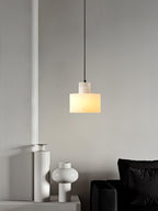 Warm alabaster pendant light lighting a quiet corner