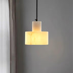 Alabaster pendant light hanging over a kitchen island