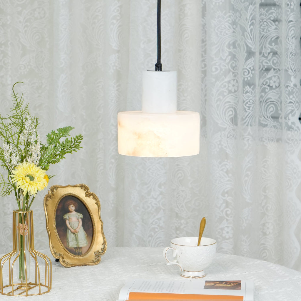 Alabaster pendant light suspended in a warm, calm space