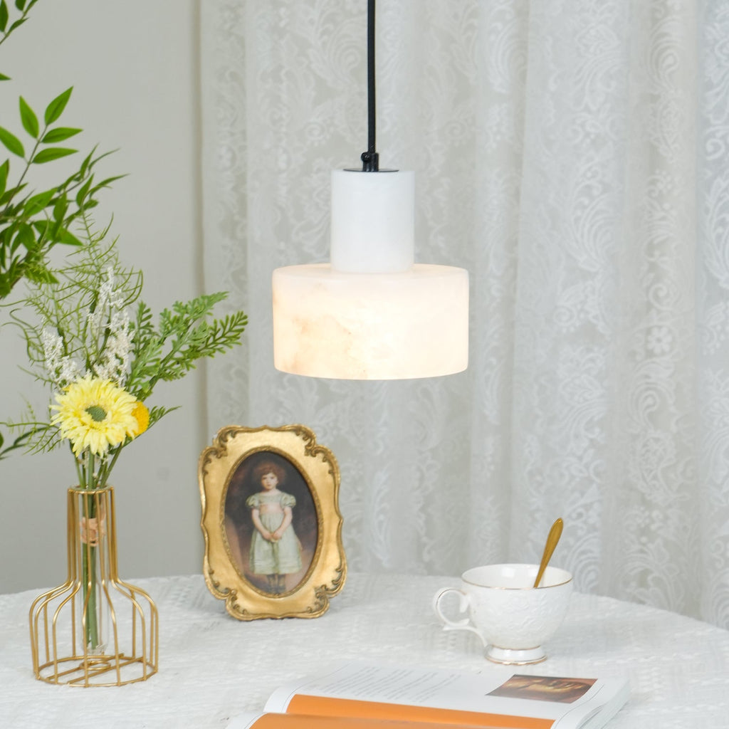 Alabaster pendant light lit, natural pattern clearly visible