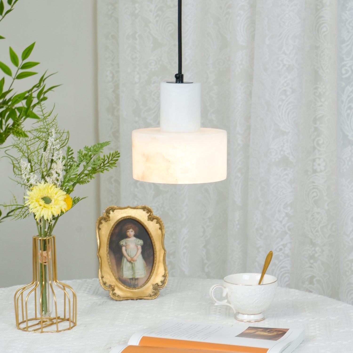 Alabaster pendant light lit, natural pattern clearly visible