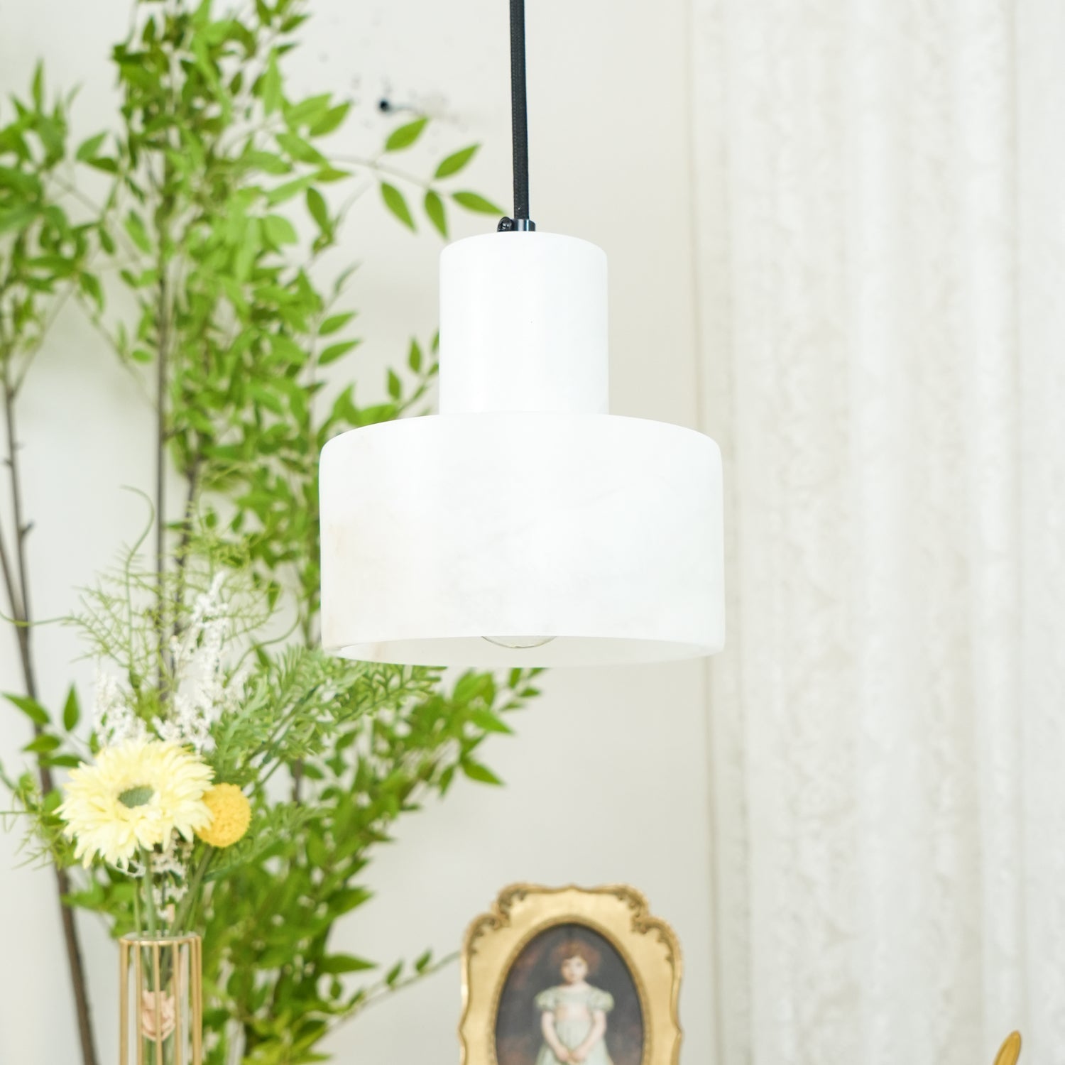 Warm alabaster pendant light detail with unique stone veining
