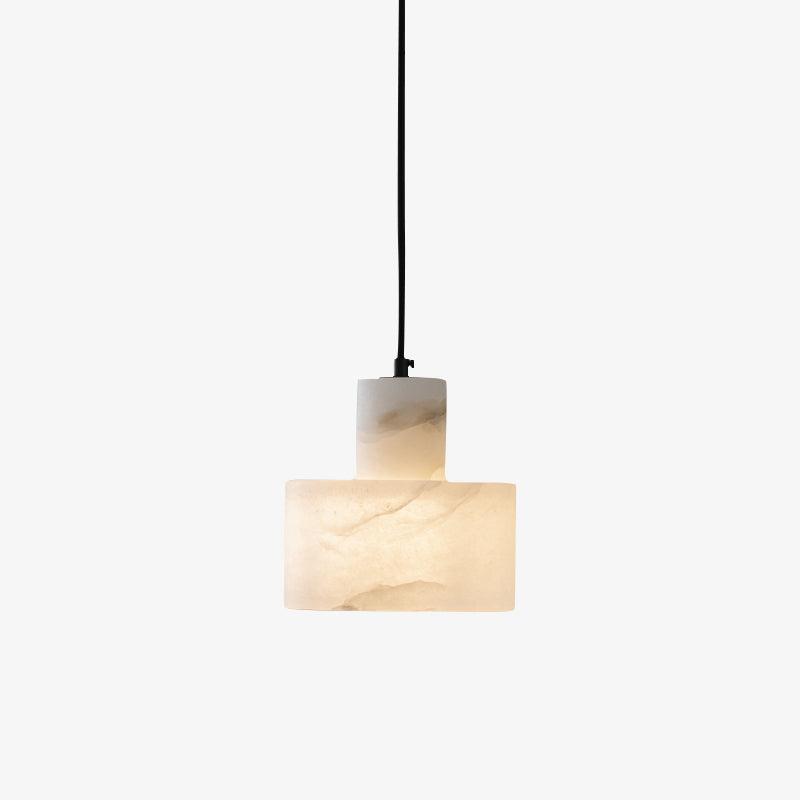 Hand-cut alabaster pendant light suspended above a nightstand