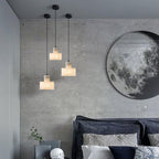 Alabaster pendant light hanging in a calm bedroom setting