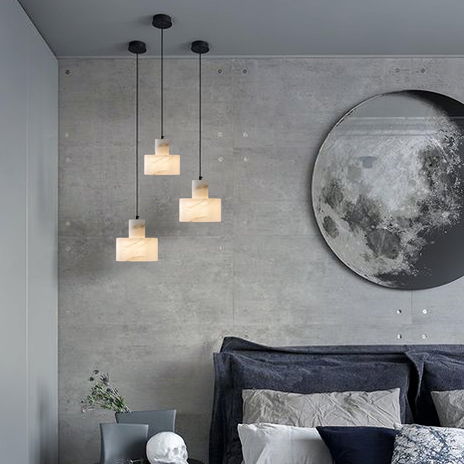 Alabaster pendant light hanging in a calm bedroom setting