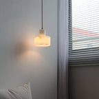 Warm alabaster pendant light casting a soft ambient glow