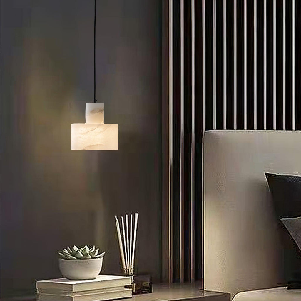 Alabaster pendant light shown unlit, highlighting the polished stone