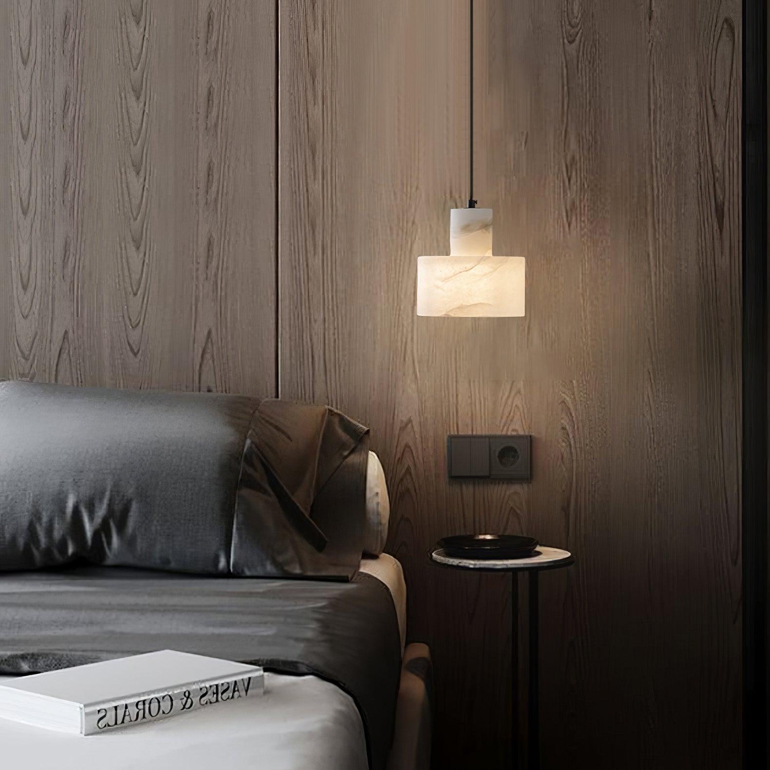 Pair of alabaster pendant lights clustered above a seating area