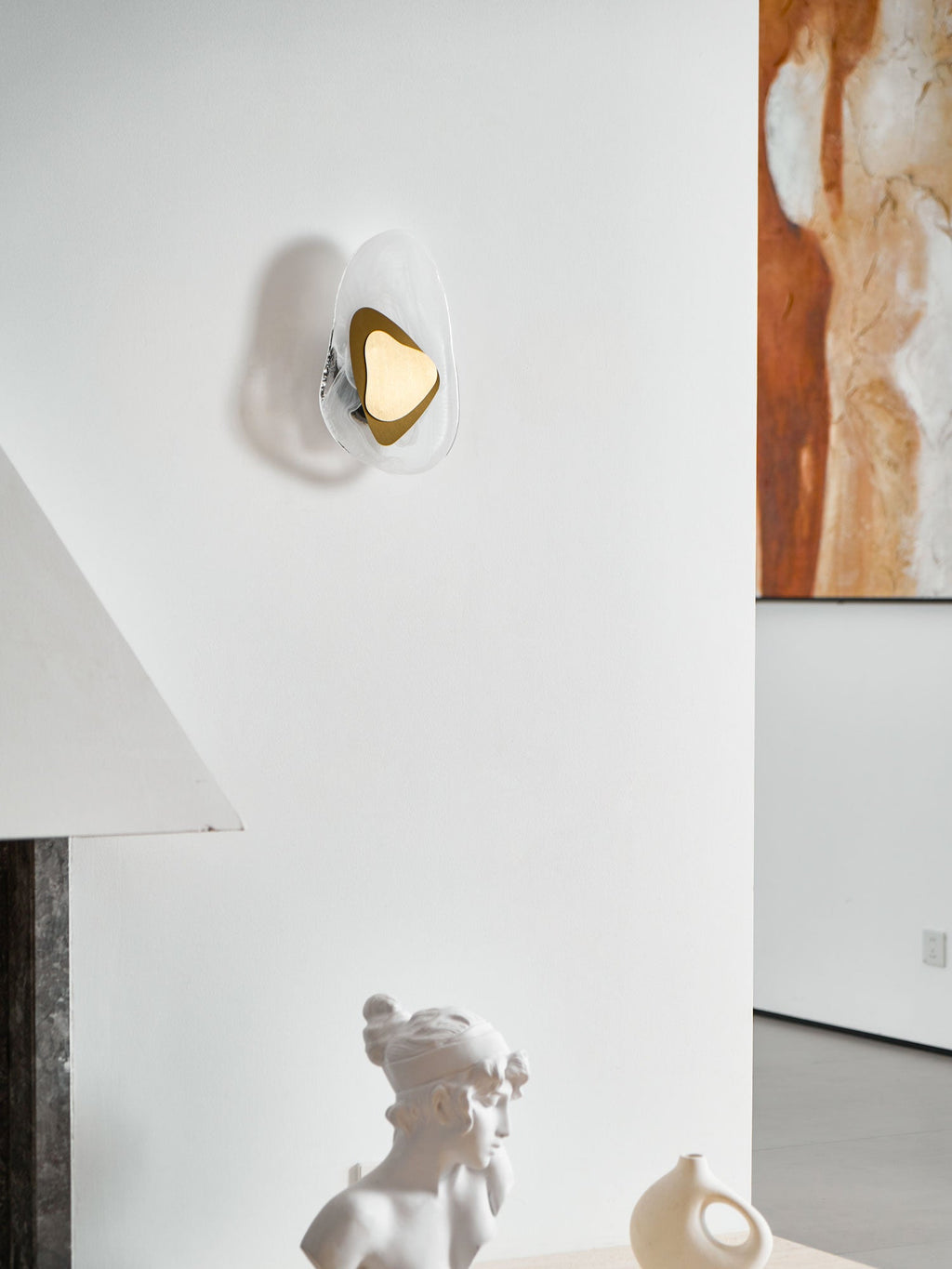 Copper wall lamp casting a warm pool of light