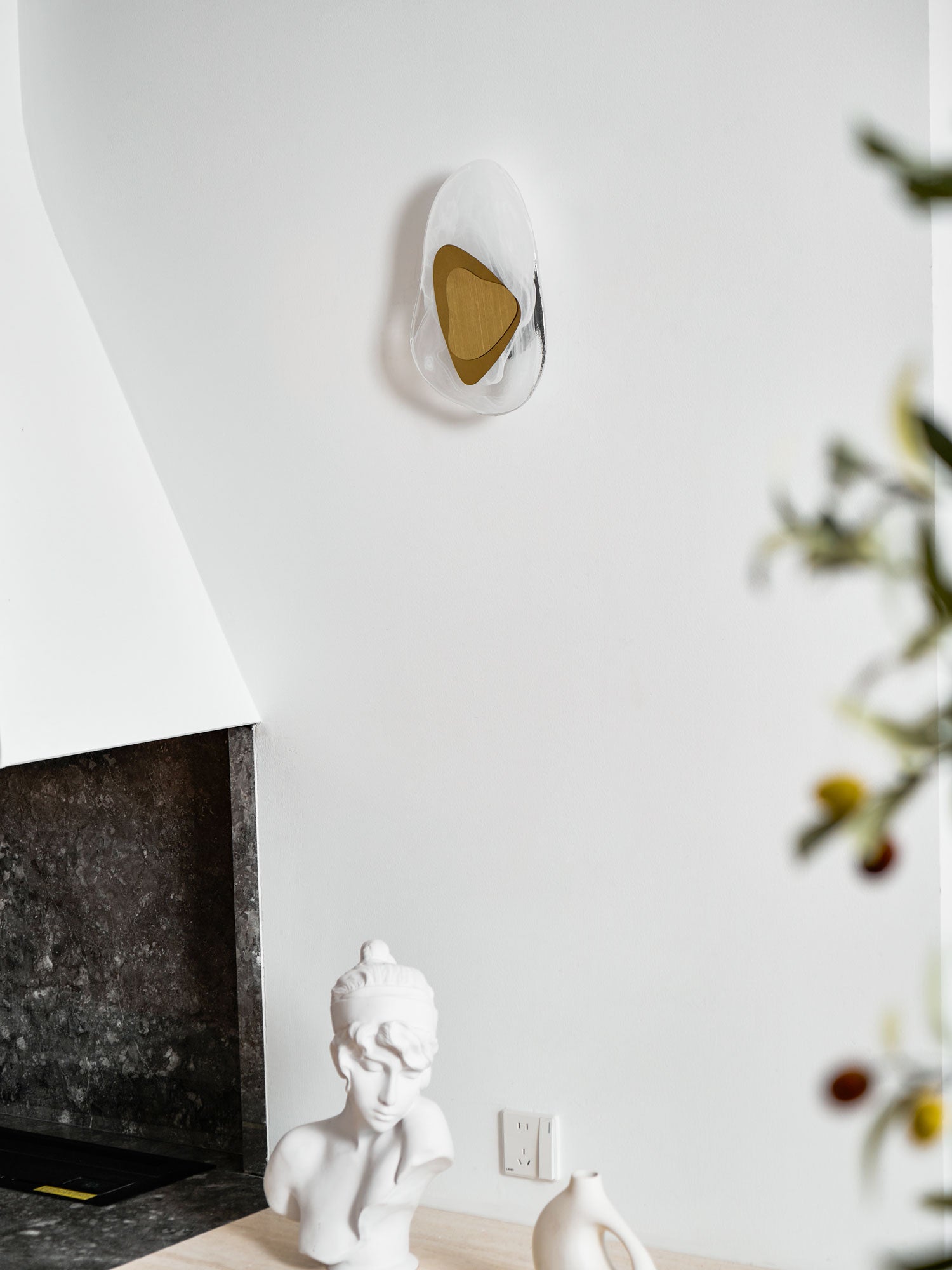 Wall lamp glowing gently to add character to a hallway