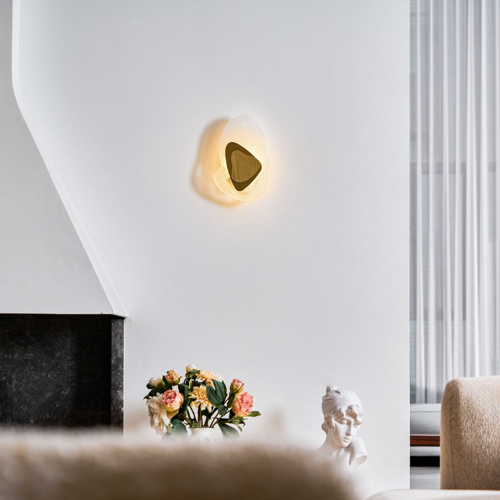Black wall lamp glowing softly as a decorative statement