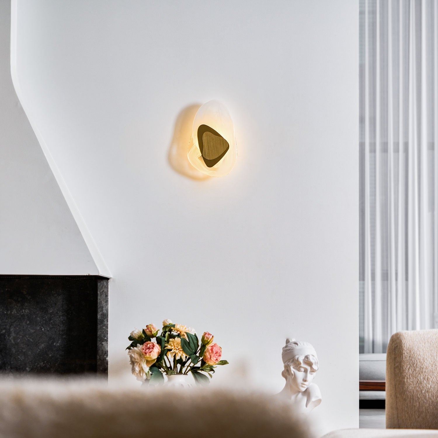 Black wall lamp glowing softly as a decorative statement