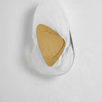 Wall lamp with translucent glass shade as a finishing accent