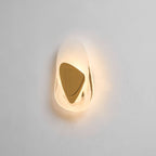 Black wall lamp shown lit and decorative on a plain wall