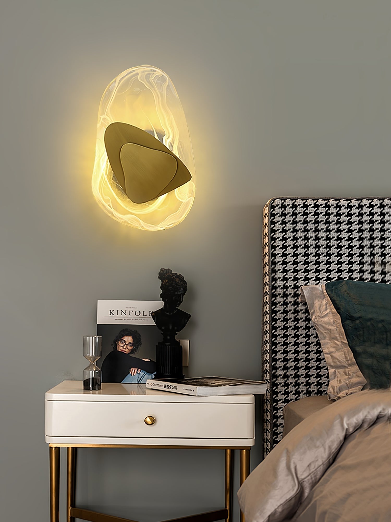 Wall lamp with translucent glass shade in a styled interior shot