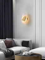 Translucent glass wall lamp adding ambient glow to a reading nook