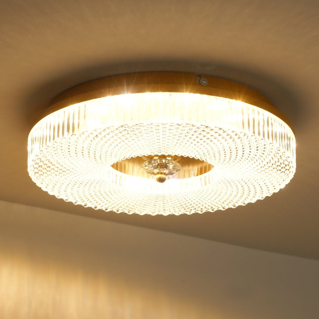 Flush mount LED ceiling light lit evenly in a modern room
