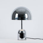 A plain product shot of this Clérachic table lamp in polished chrome against a soft grey backdrop.