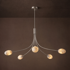Side angle of this Clérachic chandelier in brushed nickel, showing the curved arms fan from a central stem.