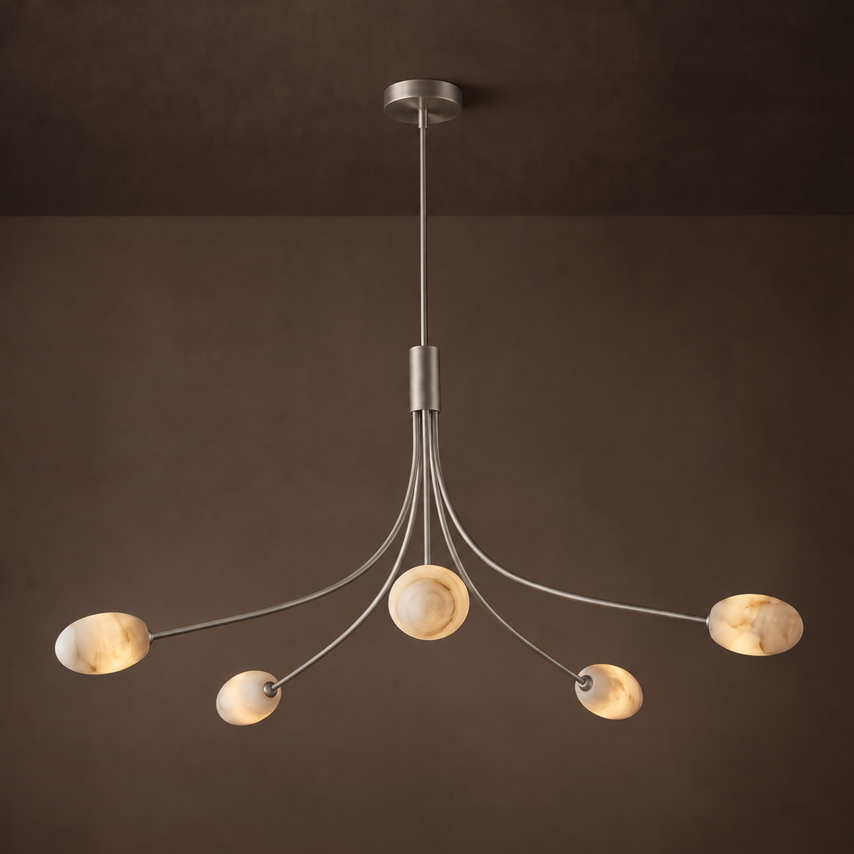 Side angle of this Clérachic chandelier in brushed nickel, showing the curved arms fan from a central stem.