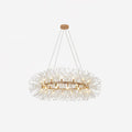 Gold ring chandelier on white, its bulbs ringed by fine wire sprays tipped with clear crystal beads.