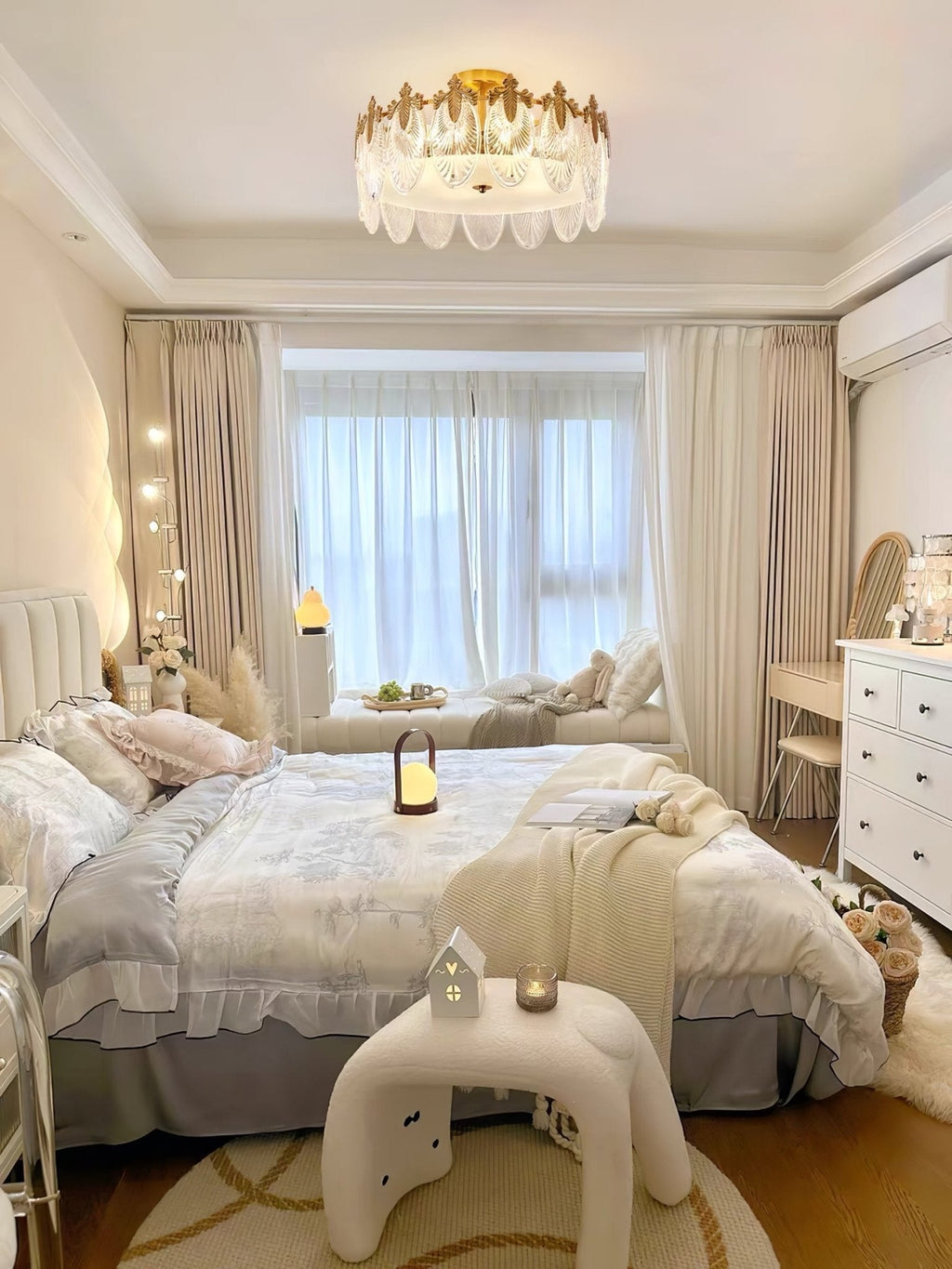 Glass petal chandelier lit warmly in an elegant room