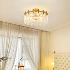 Glass petal chandelier with copper frame in a styled interior