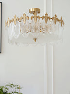 Copper-framed glass petal chandelier shown from a low angle