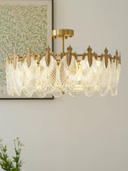 Glass petal chandelier casting glimmering light on the ceiling