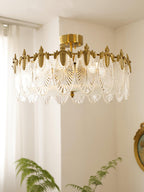 Glass petal chandelier lit in a warm, styled interior