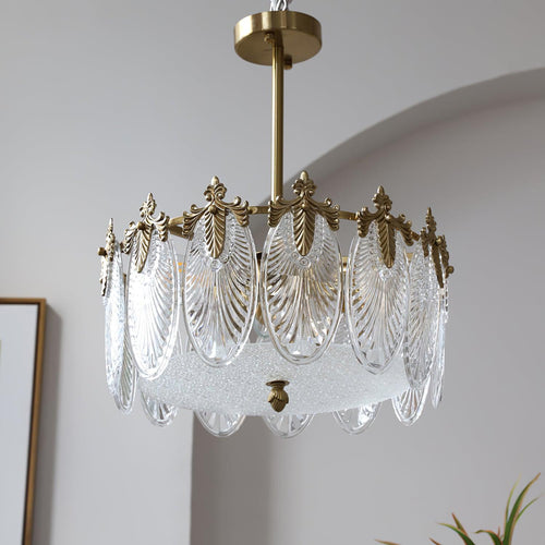 Glass petal chandelier glowing warmly with copper frame visible