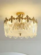 Glass petal chandelier suspended over a styled tabletop