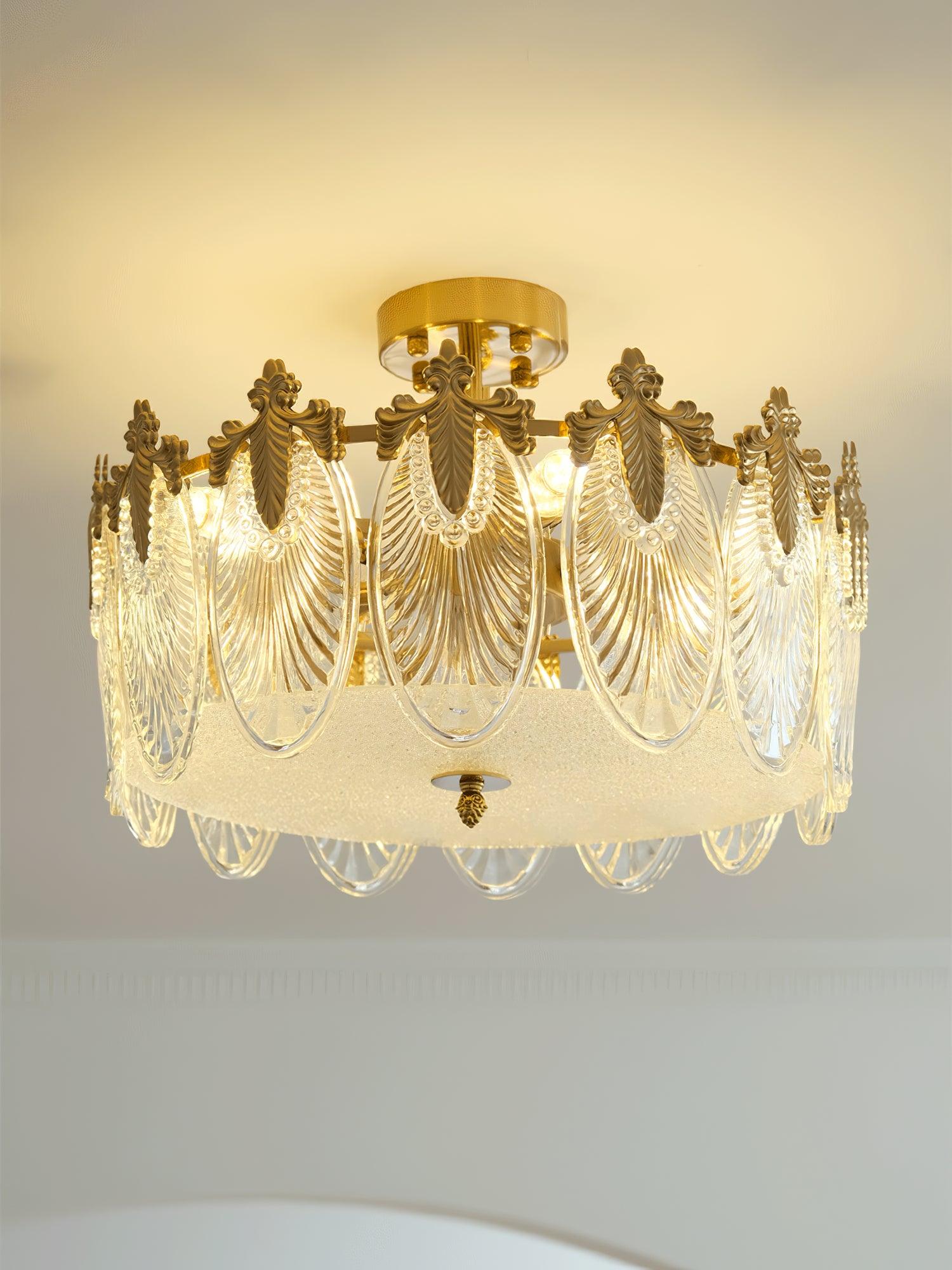 Glass petal chandelier suspended over a styled tabletop