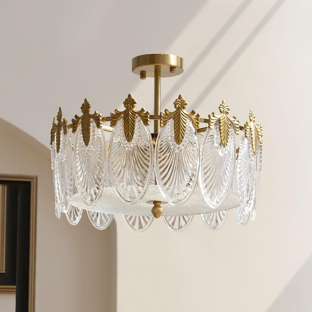 Hand-formed glass petal chandelier suspended above a dining table