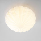 Lit and shown in full against a grey backdrop, this Clérachic ceiling light glows a warm, even white.