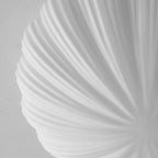 Close view of the pleated ribs on this Clérachic ceiling light's shade, shown unlit in soft grey tones.