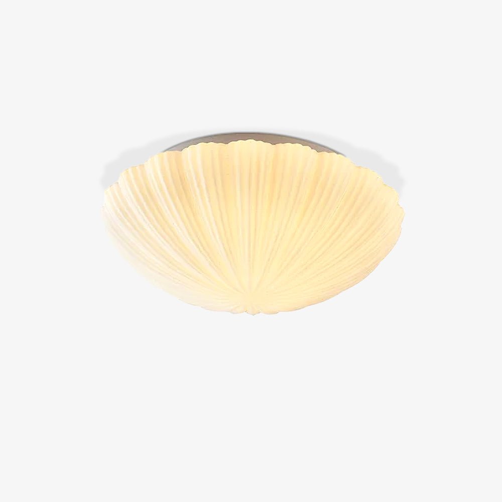 Angled on a soft grey backdrop, this Clérachic ceiling light glows warm white from within.