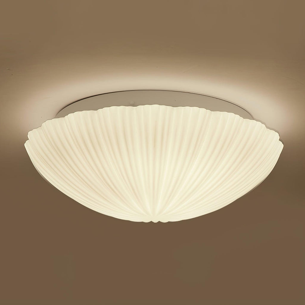 In side profile against a warm brown backdrop, this Clérachic ceiling light glows softly from within.