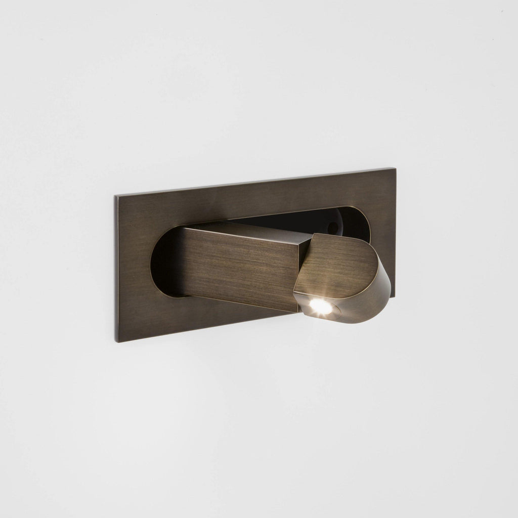 Bronze LED bedside reading light mounted on the right side