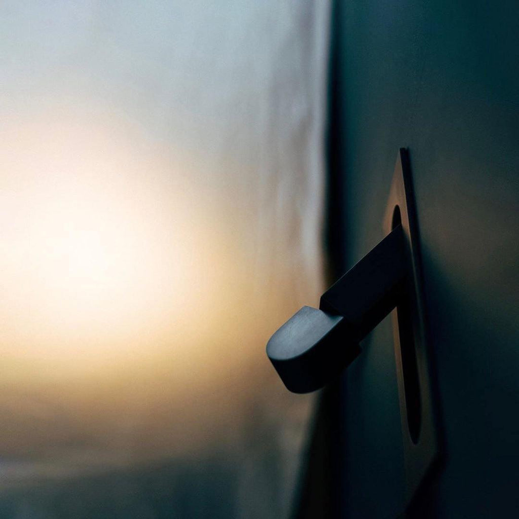 LED bedside reading light showing the adjustable head range