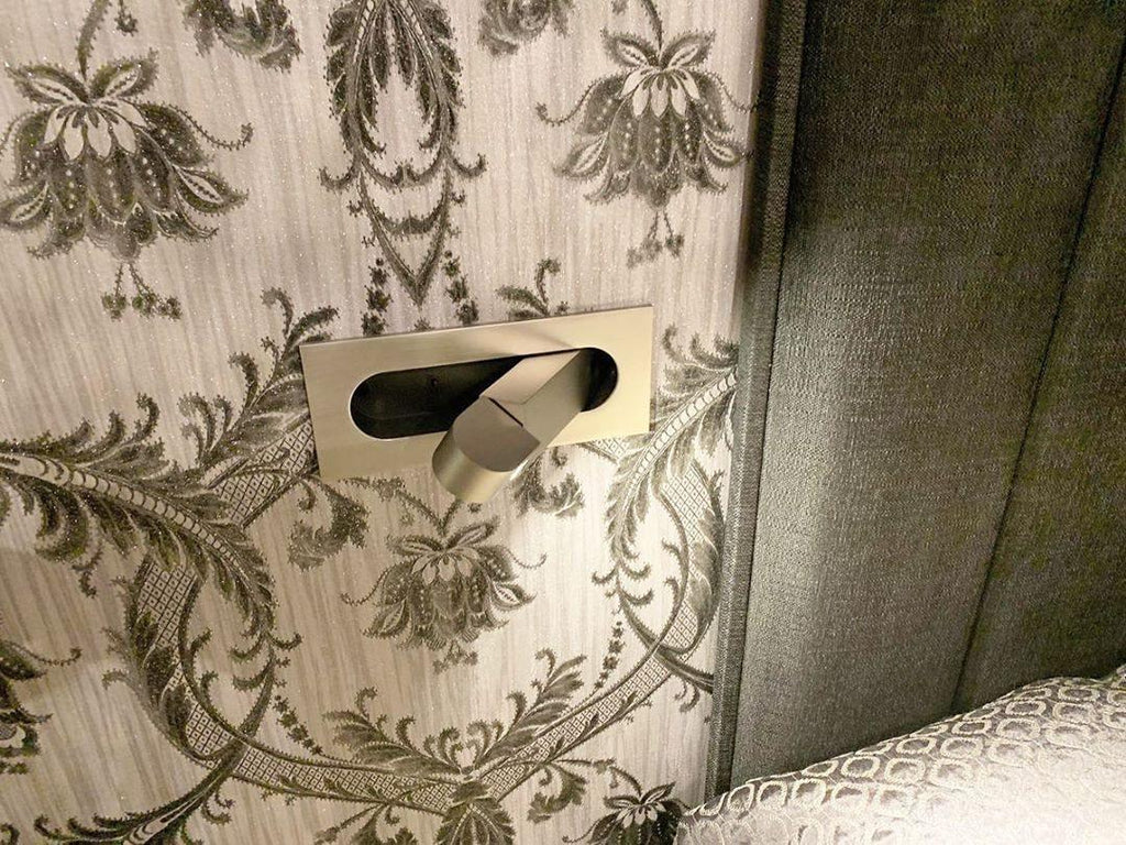LED bedside reading light shown flush to the wall