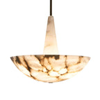 Alabaster bowl pendant on white, its heavily veined shade turned upward on a tapered stone stem.