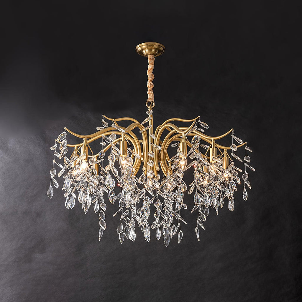 The widest version on dark grey, its curved brass arms spreading before the crystal leaves fall.