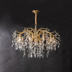 The widest version on dark grey, its curved brass arms spreading before the crystal leaves fall.