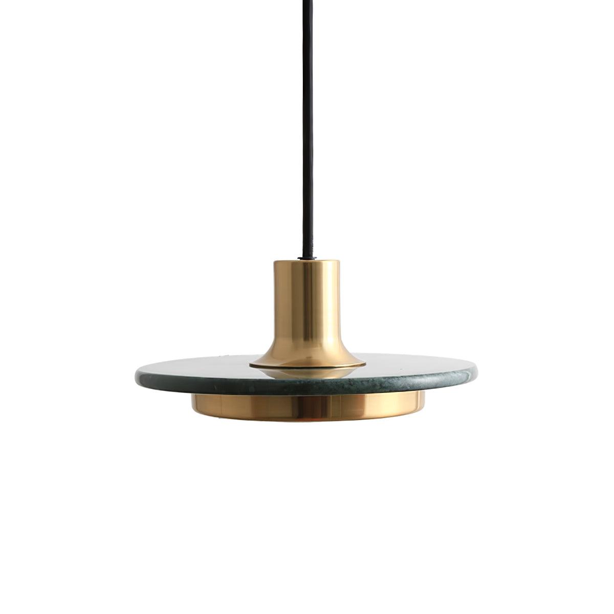 A green-veined stone disc pendant with a gold rim, angled close against white to show the Clérachic fixture's brass cap and cord.