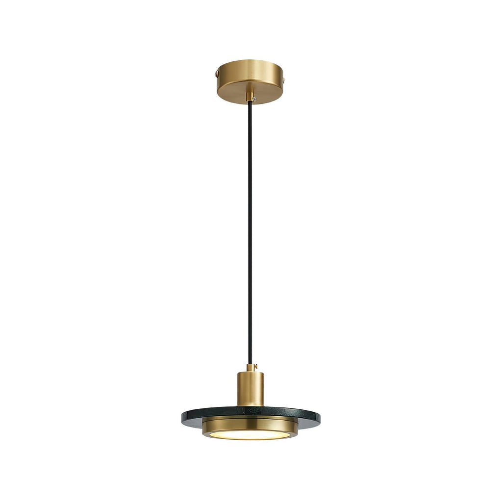 The same dark stone disc pendant hangs against a clean white backdrop, its full brass-topped cord visible in this Clérachic studio shot.