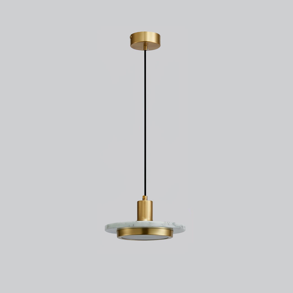 A black-and-gold Clérachic pendant light on plain grey, showing the full cord run from ceiling cap to shade.