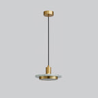 A black-and-gold Clérachic pendant light on plain grey, showing the full cord run from ceiling cap to shade.