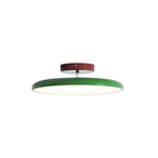 Adjustable ceiling lamp angled to direct light across a room