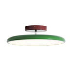 Round acrylic ceiling lamp on adjustable arm in a modern room